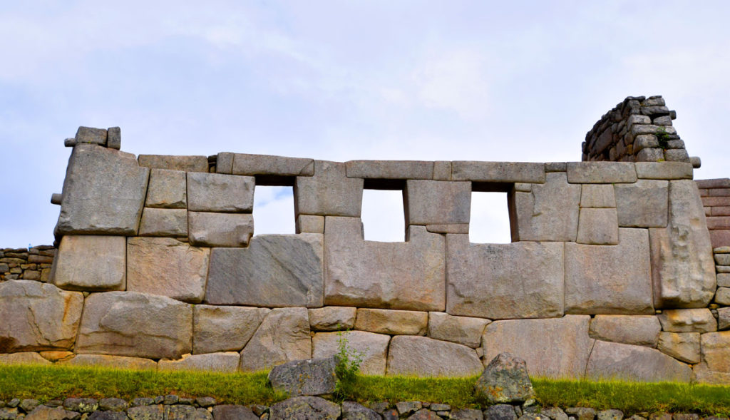 The Temple of Three Windows well illustrates the ashlar building technique used by Inca builders - precisely cut stone blocks (in this case granitoid blocks) that fit so well with adjoining blocks that no mortar is needed.